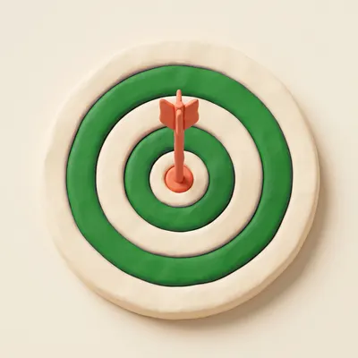 Clay archery target with a coral arrow in the bullseye
